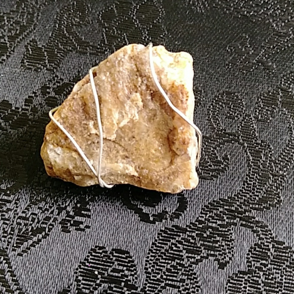 Wire wrapped healing stone pendant